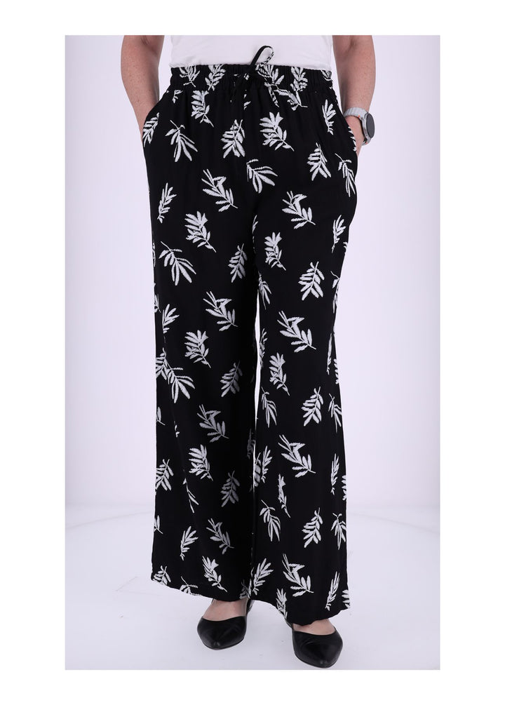 Damen Schlupfhose mit Palmwedel-Print – Schwarz