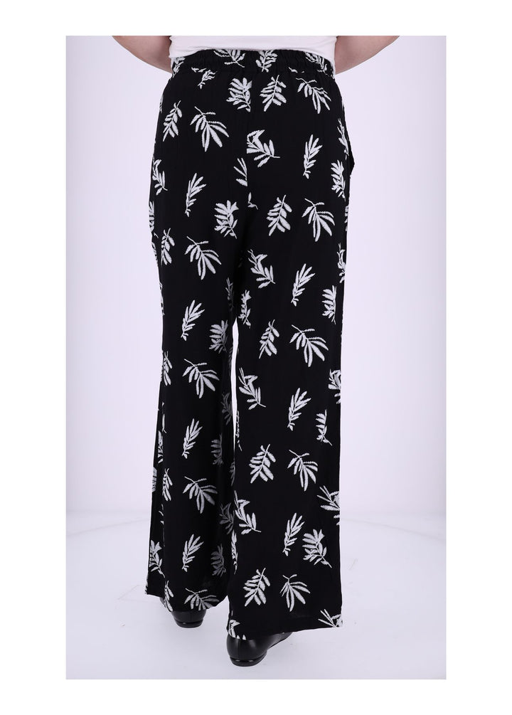 Damen Schlupfhose mit Palmwedel-Print – Schwarz